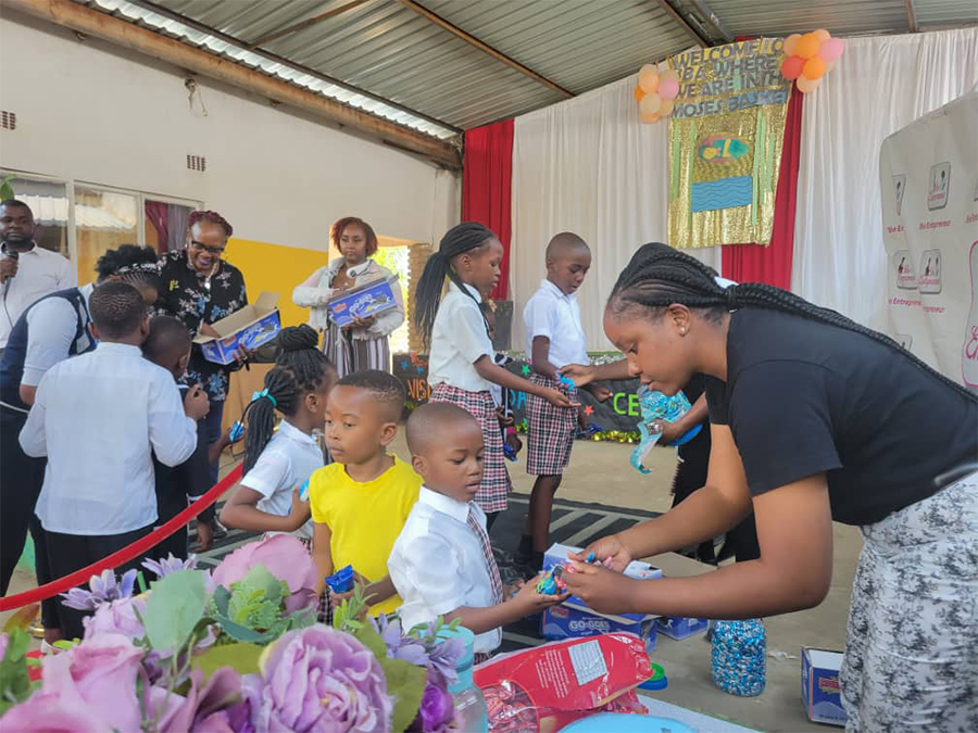 Tiffany Young and KaPreace Young handing out snacks to the kids at Best Buddies School