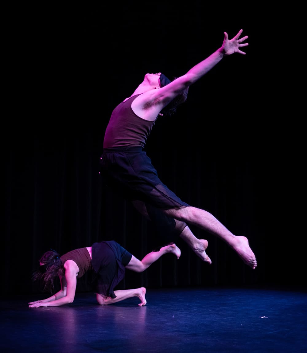 Two Fall Festival dancers on stage performing with blindfolds on.