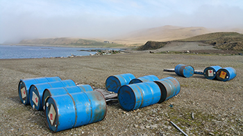 barrels by shoreline