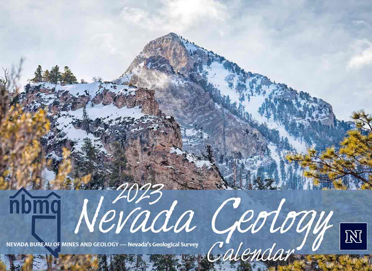 A snowy mountain peak with trees in the foreground and scattered on the mountainside. Text reads, "2023 Nevada Geology Calendar"