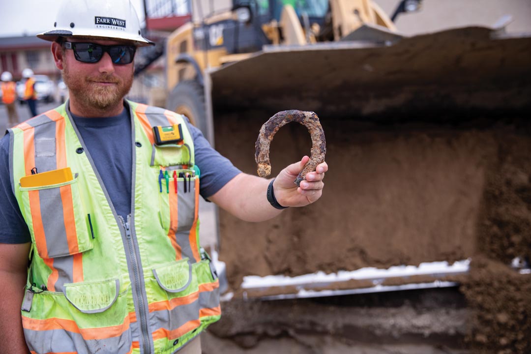 Engineer holding an old horseshoe