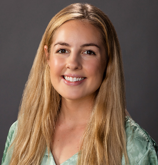 Portrait of Elizabeth wearing a light green shirt.