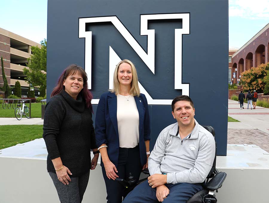 Shanon S. Taylor, Lindsay Diamond and Randall Owen in front of the N sign near the Knowledge Center.