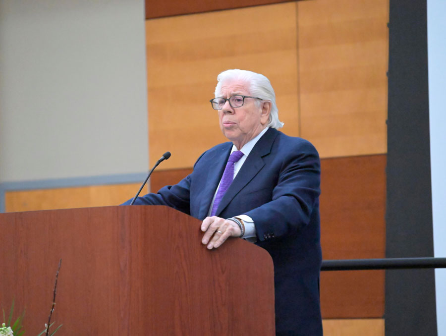 Carl Bernstein speaking at a podium.