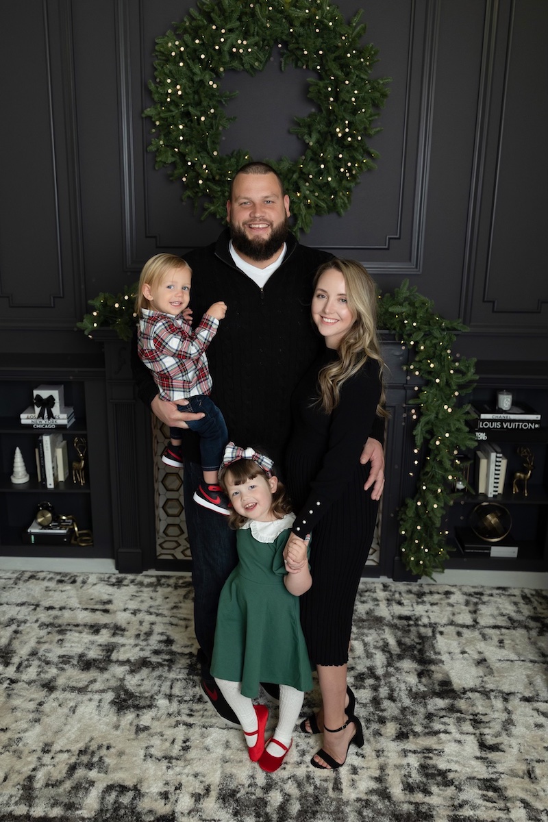 Joel Bitonio and his family pose in formal wear for a Christmas portrait.