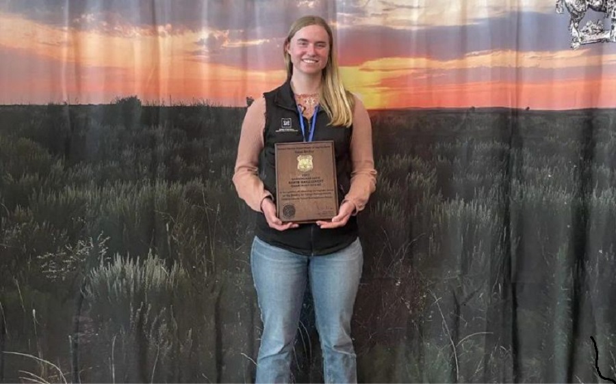 Elsie Childress holding her award.