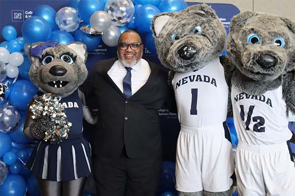 Dean Donald Easton-Brooks with three mascots
