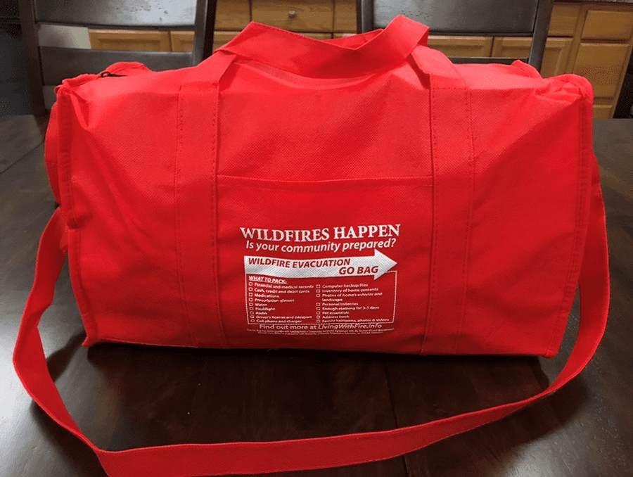 A red evacuation go-bag packed and ready for an emergency.