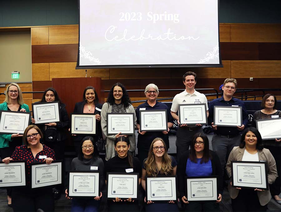 Students and faculty with their awards