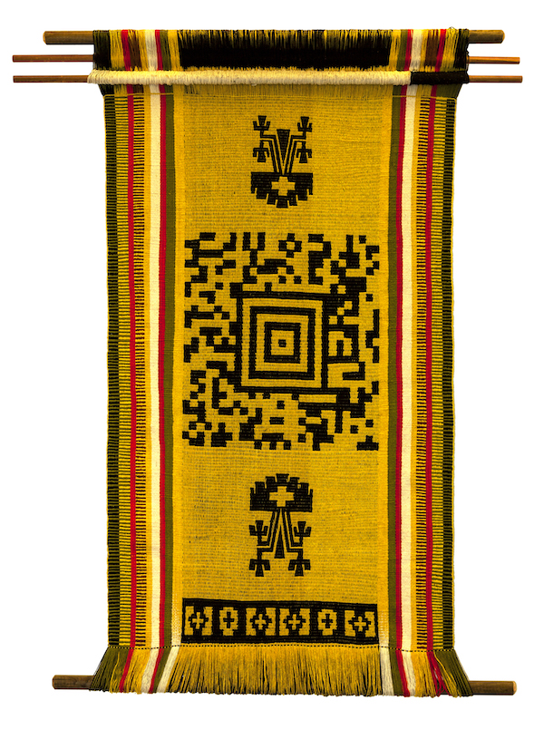 A yellow woven tapestry with geometric figures on it.