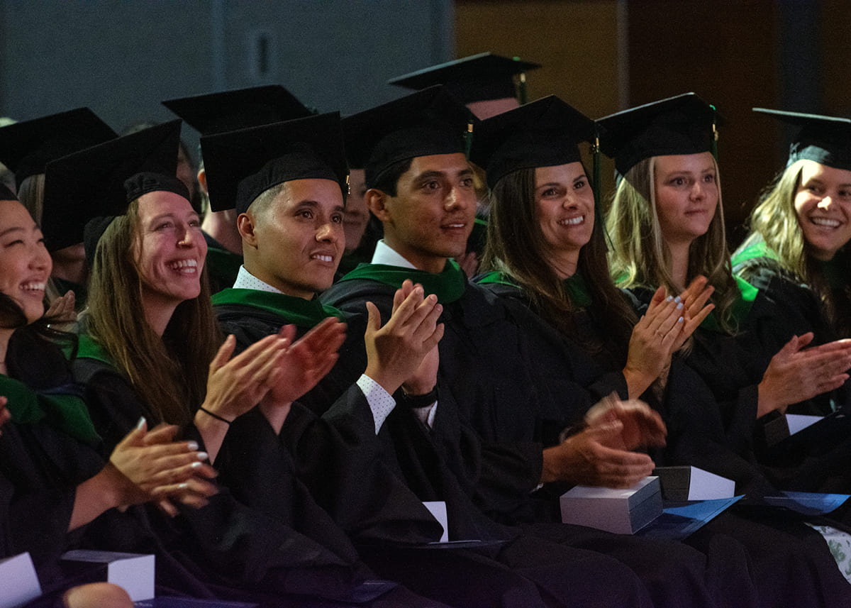 Graduates of the UNR Med PA Studies Program applaud at their commencement ceremony on Wednesday, July 26, 2023, at the Joe Crowley Student Union.