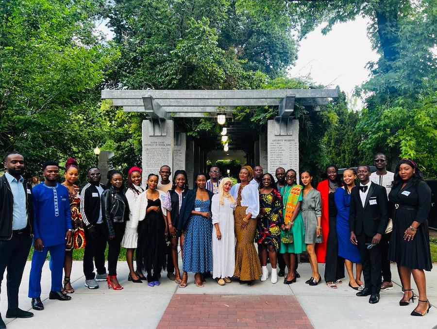 23 African leaders of the Mandela Washington Fellowship Program posing in front of marble arch on-campus at the University of Nevada, Reno