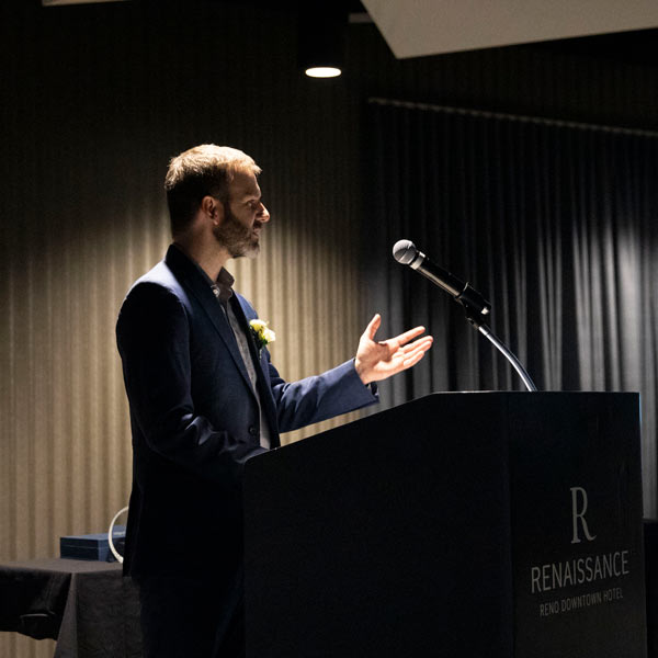 Patrick Barber speaks at a podium