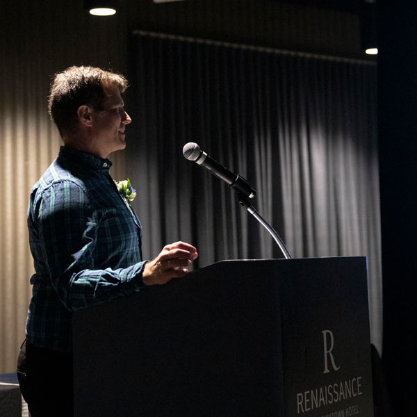 Dan Sturmer speaks at a podium.