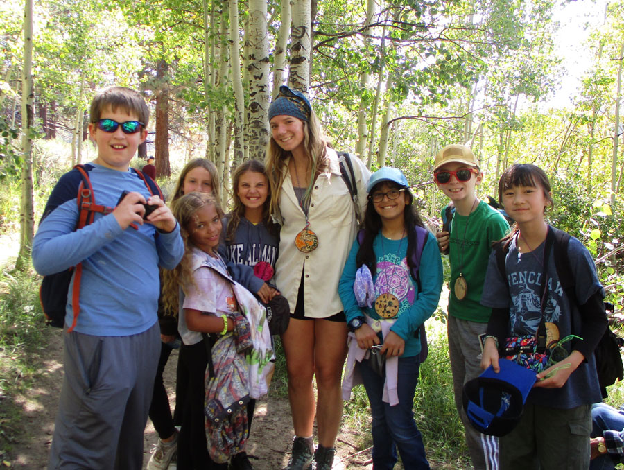 Emma Montgomery outside with a group of kids