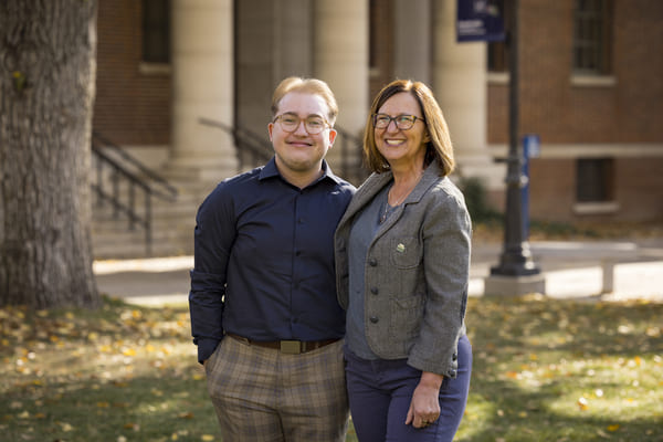 Ryan Vortisch and Alissa Surges stand outside on the quad, smiling. 