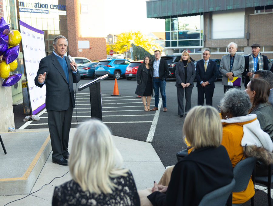 Phil Satre speaks to a crowd