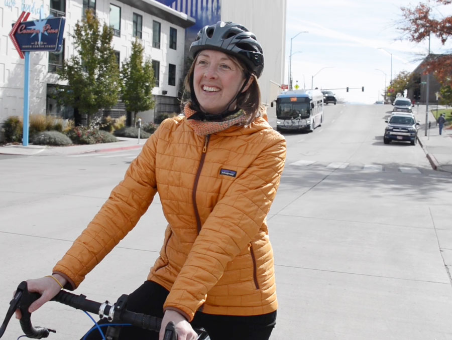 A cyclists on a street with cars