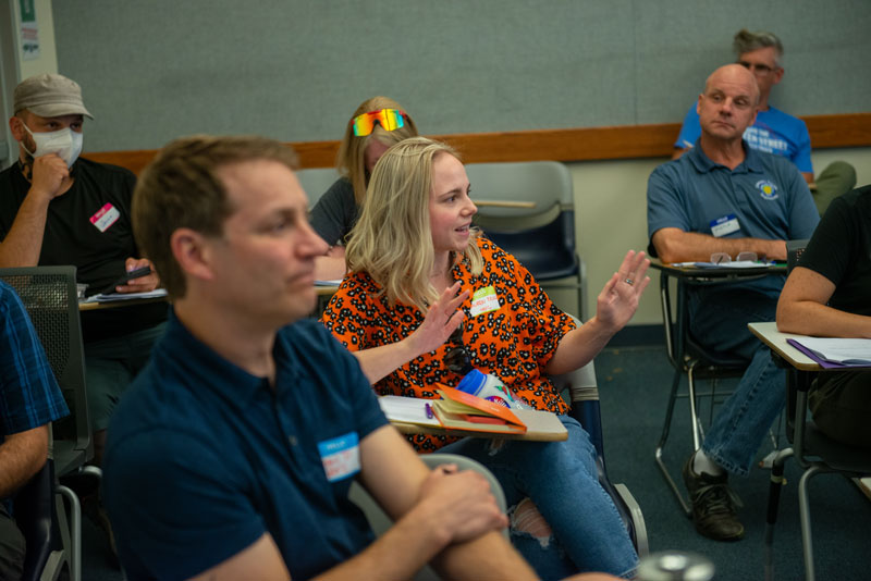 Person speaks in classroom setting