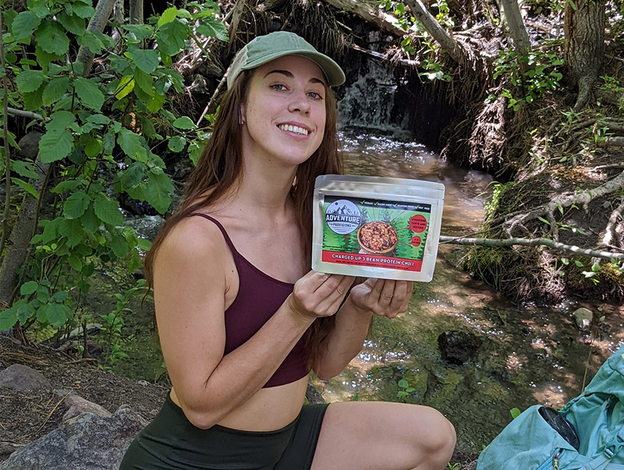 Sierra Hixson holding her product, Adventure Provisions, up to the camera.