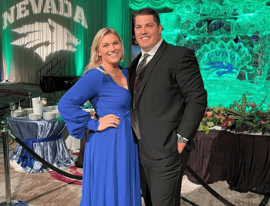 Austin Corbett standing with his wife Madison at a formal UNR event. 