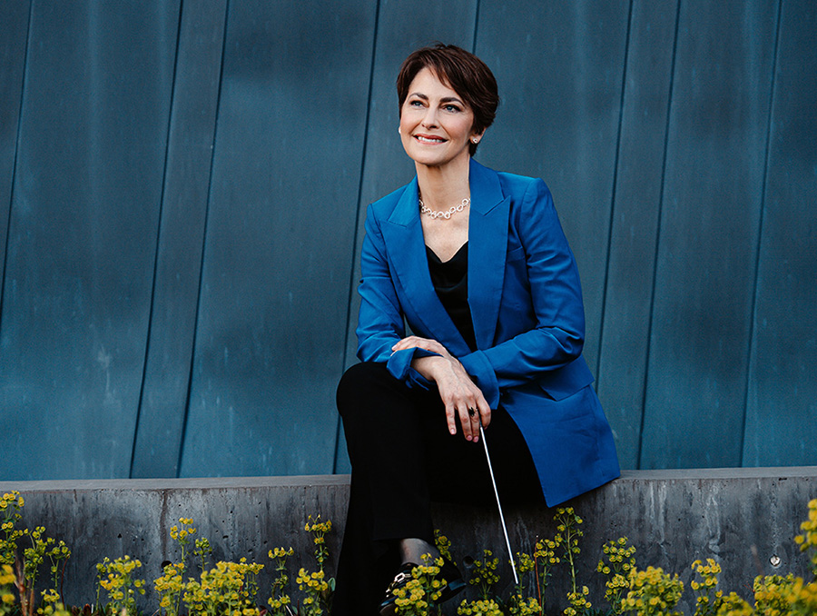 Laura Jackson sits in front of a blue background.