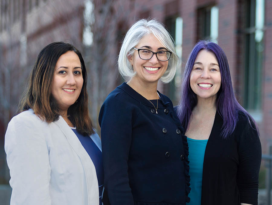 Maryam Raeeszadeh-Sarmazdeh, Neda Etezadi-Amoli and Heather Burkin standing outside and shown from the waist up.