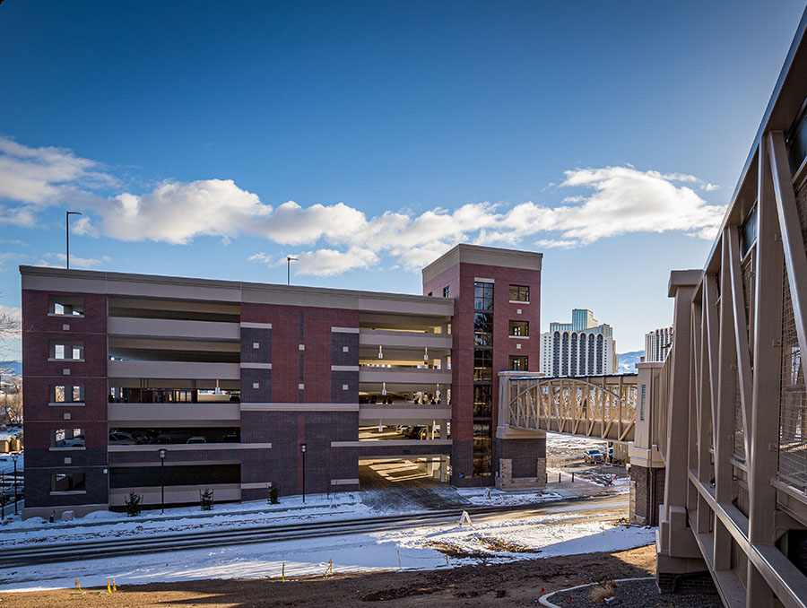 View of the north side of the Gateway Parking garage with the pedestrian bridge on the right-hand side.