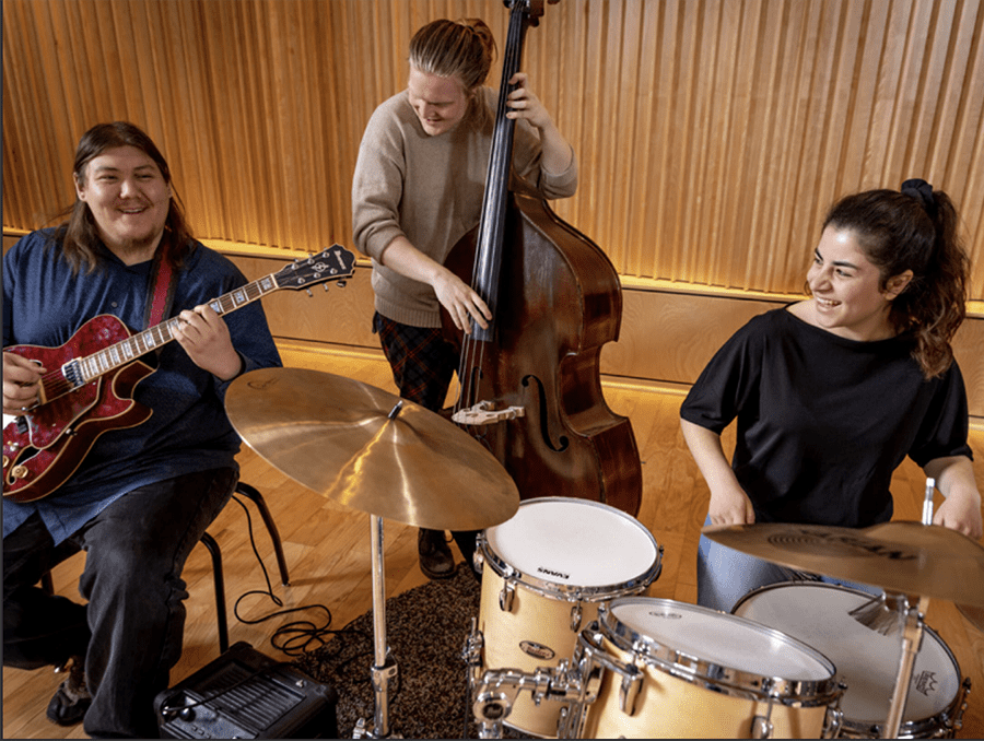 Students playing musical instruments.