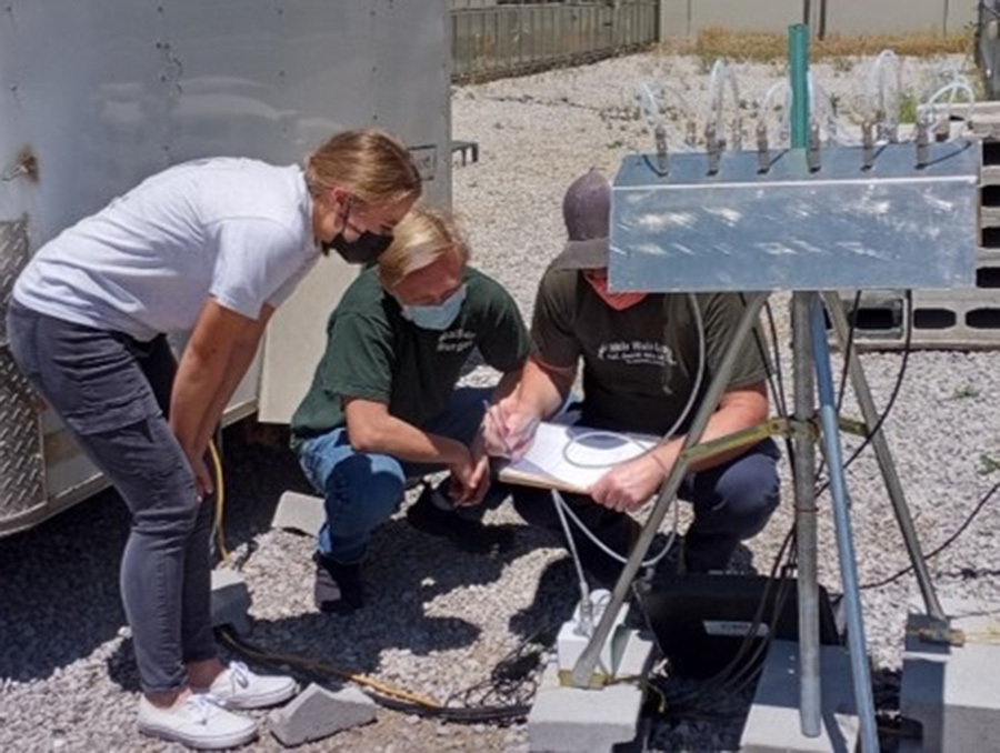 University students outside while learning to use one of the atmospheric mercury measurement systems.