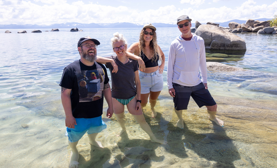 Group photo standing in Lake Tahoe