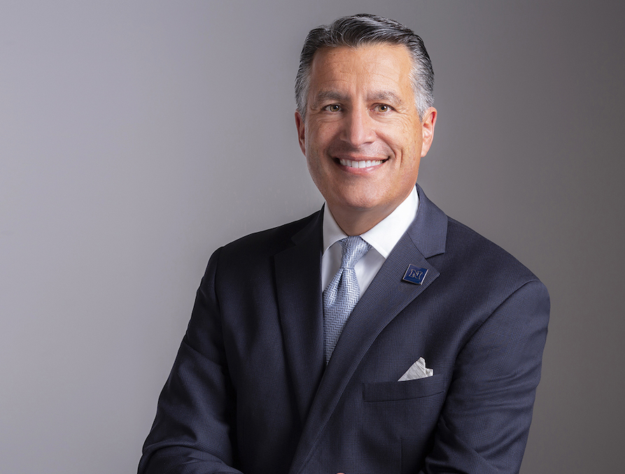Headshot of a smiling President Brian Sandoval