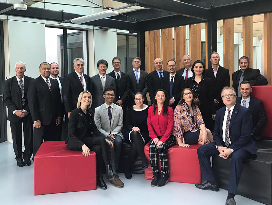 A group of faculty and students from the 2019 trip to Warsaw, Poland gather for a picture 