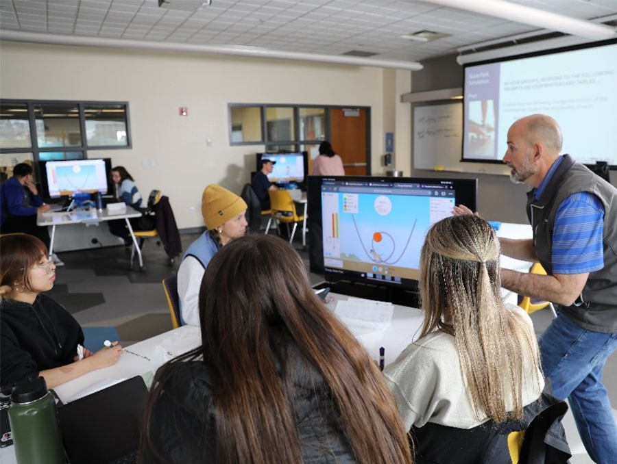 Nick Memsgern with students