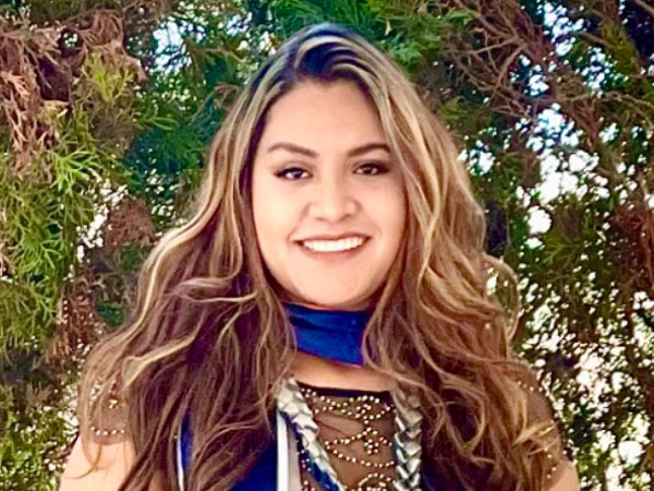 A portrait of Angelica Perez with her graduation regalia.