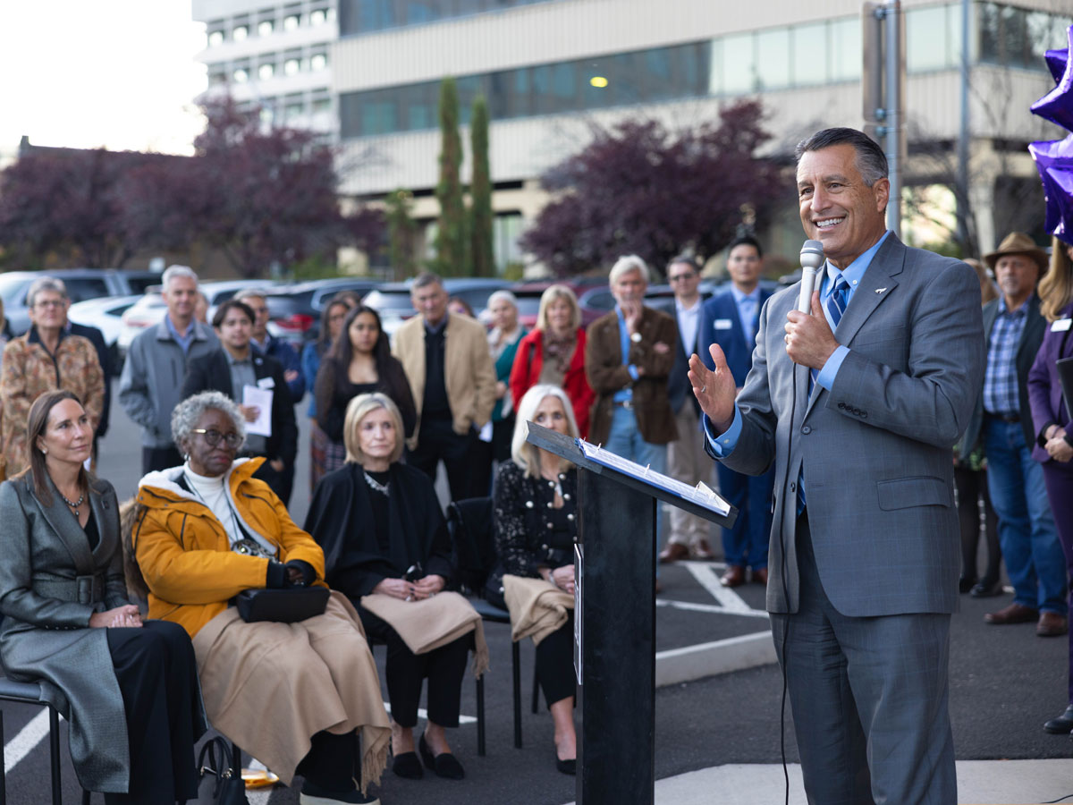 President Sandoval speaks at a podium