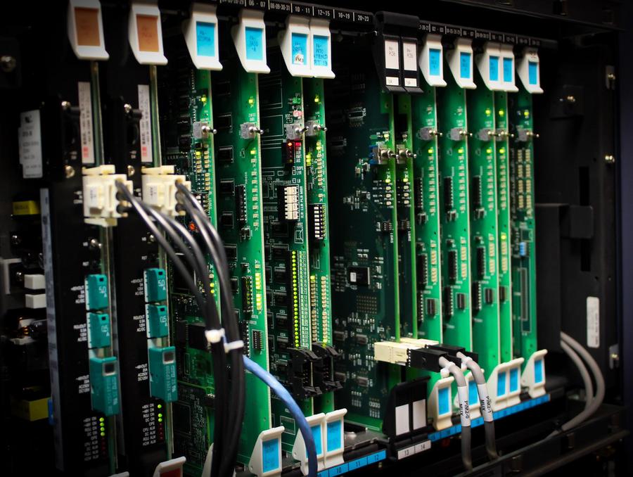 The inside of a computer showing circuit boards and wires