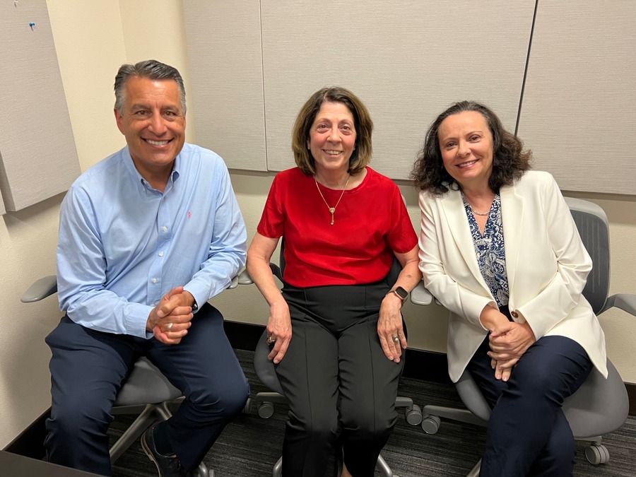 President Brian Sandoval sits next to Dean Wichinsky and Associate Dean Weiss in the podcasting room at the Reynold's School of Journalism.
