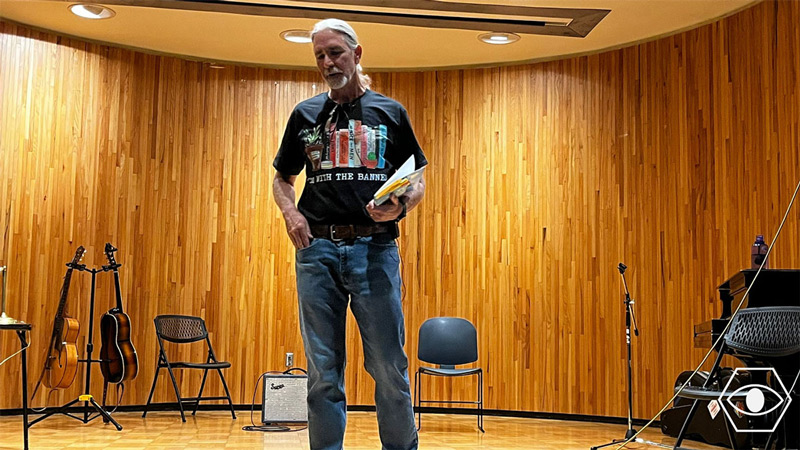 Michael Branch speaking to a group about his work