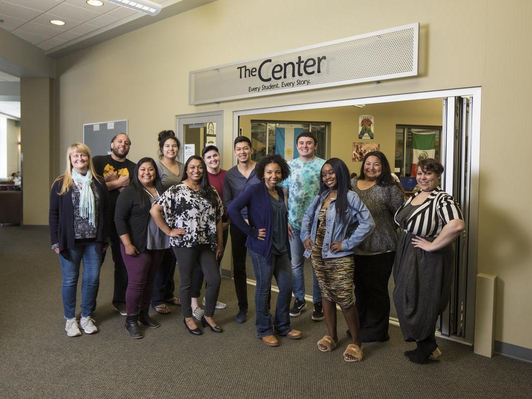 Students and faculty stand in front of the The Center