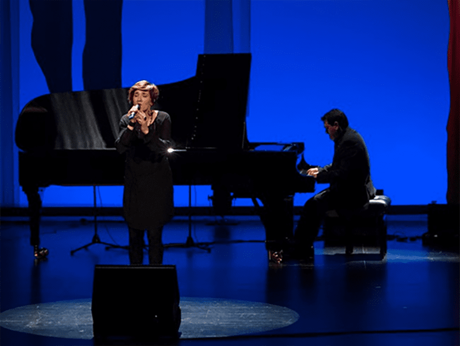 Internationally acclaimed Basque performers, Joxan Goikoetxea and Olatz Prat, on stage.