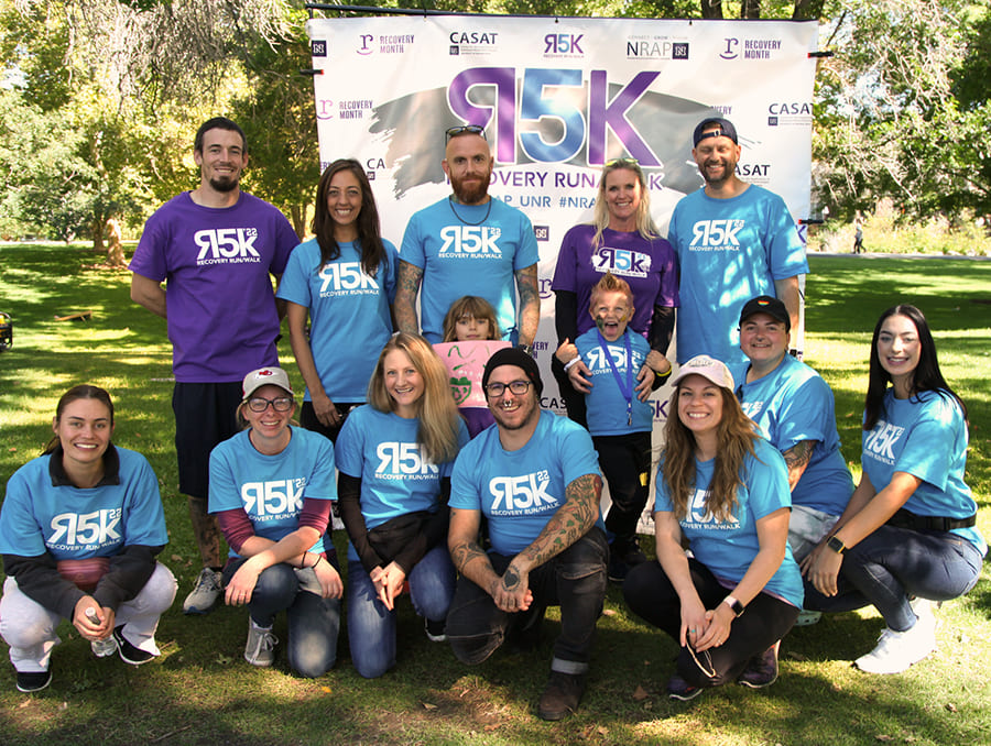 Participants from last year's NRAP 5k event smiling together for a picture.