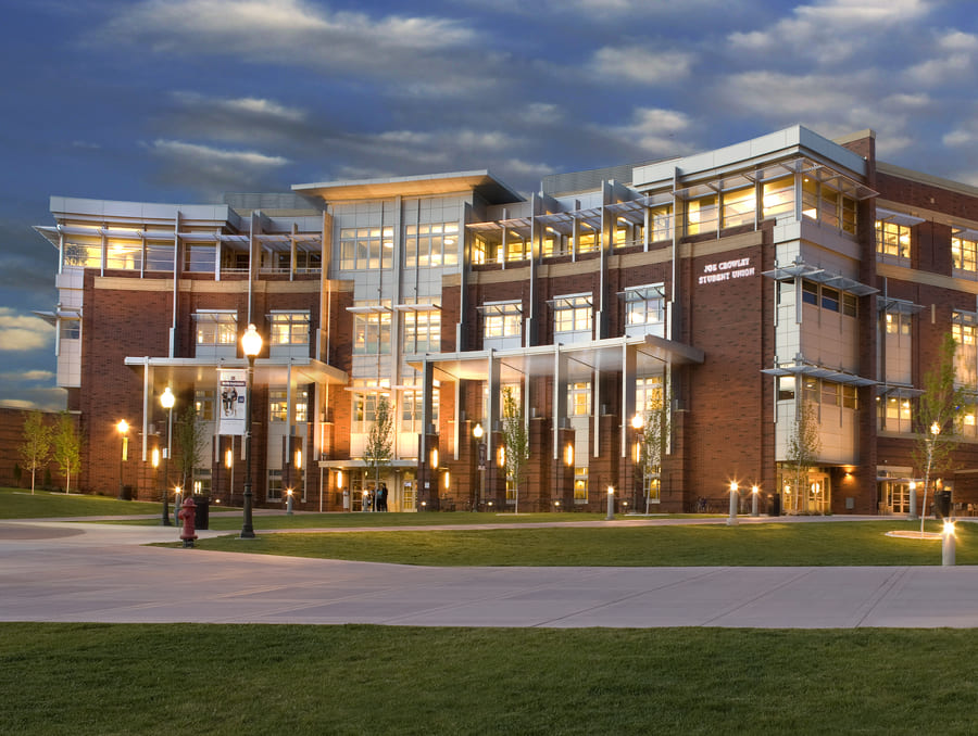 The Joe Crowley Student Union from the outside at night. 