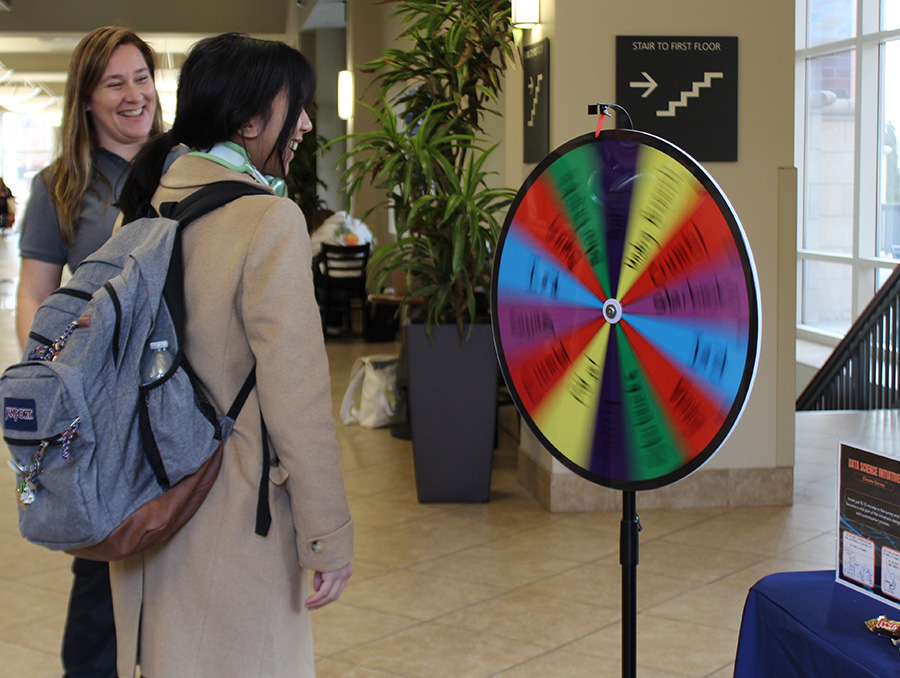 Student spinning a wheel.
