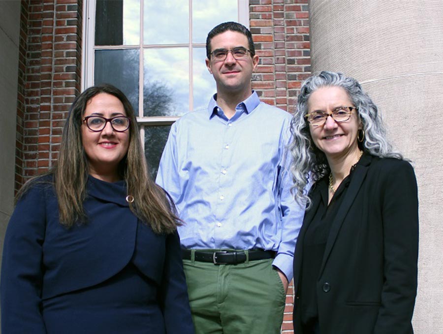 Maryam Sarmazdeh, David Cantu and Ana Bettencourt standing in front of a brick building