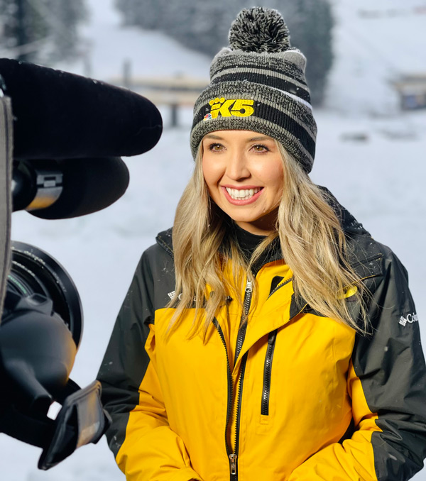 Conner reporting on camera from a snowy scene.