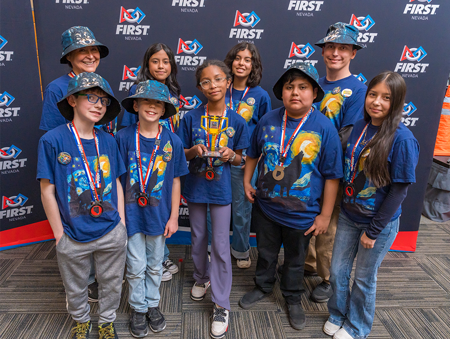Wolf Pack Bots Team with trophy