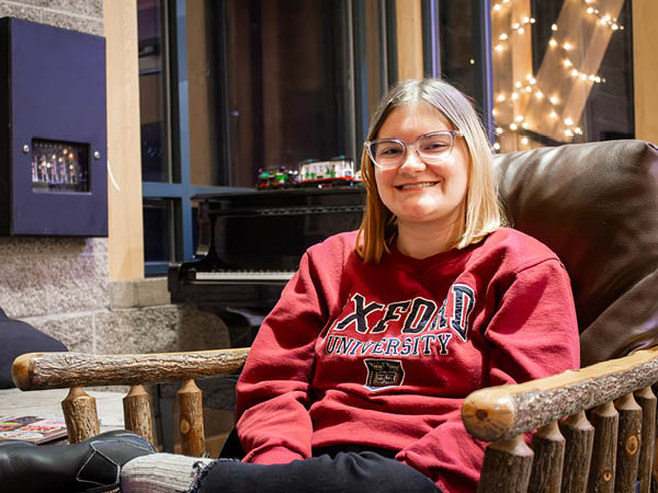 Dani Kuntz sits in a lounge chair in Patterson Dining Hall