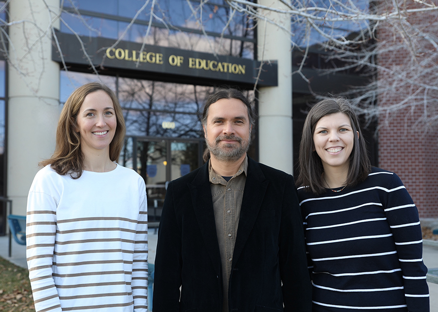 Alexandra Aylward, Raúl Olmo Fregoso Bailón and Laura Smithers in front of the College of Education building.