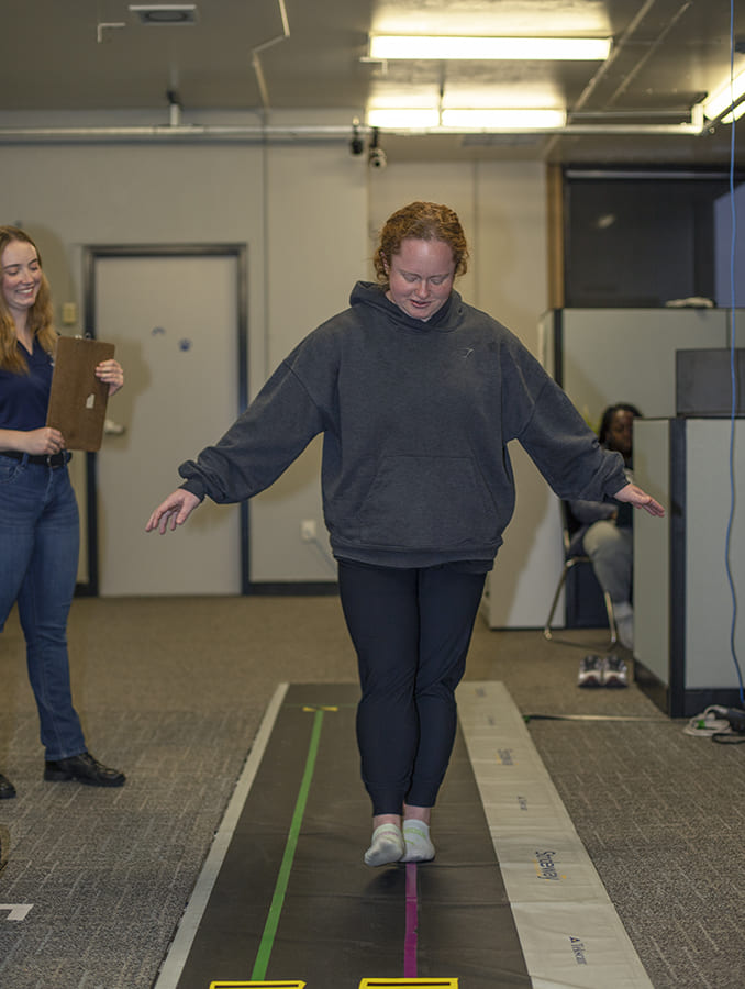 A balance assessment being conducted at the Neuromechanics Lab.